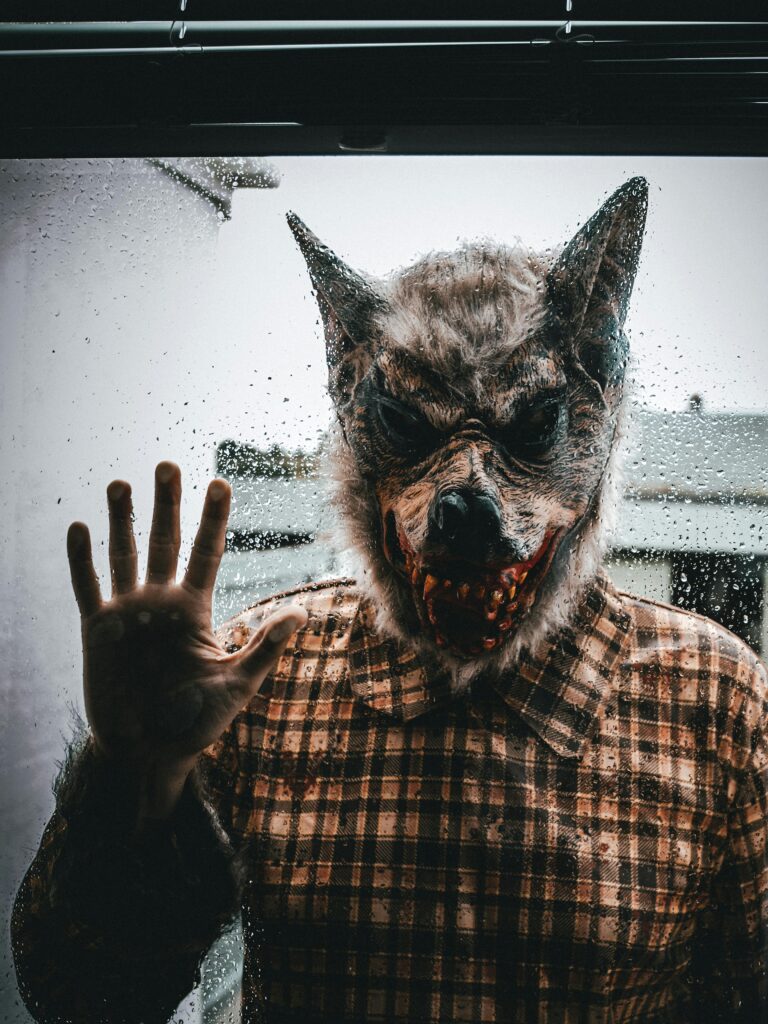 A werewolf at a sliding glass door.
