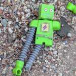 Header depicting a broken robot toy.