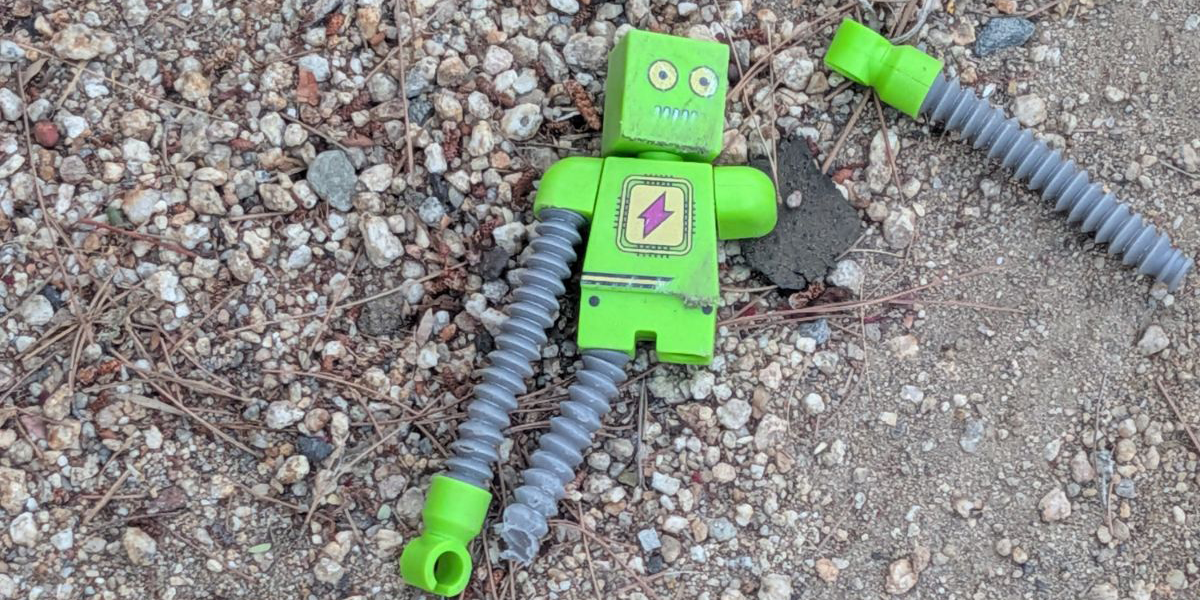 Header depicting a broken robot toy.