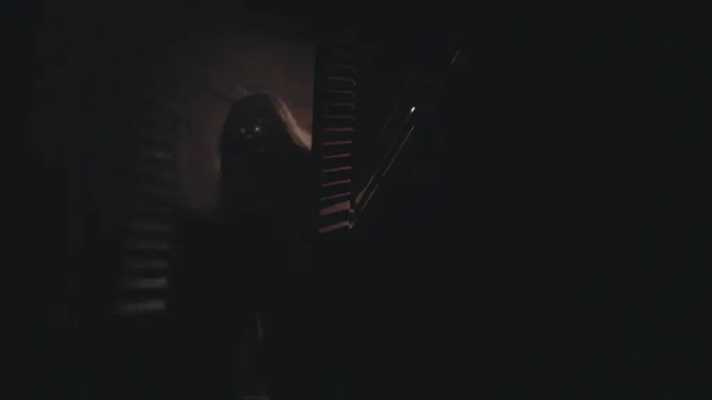Screencap of "The Music of Mr. Sze" from V/H/S/Mixtape